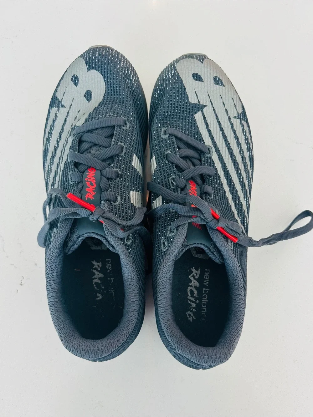 New Balance Men's Racing Shoes in Charcoal Gray with White and Red Accents